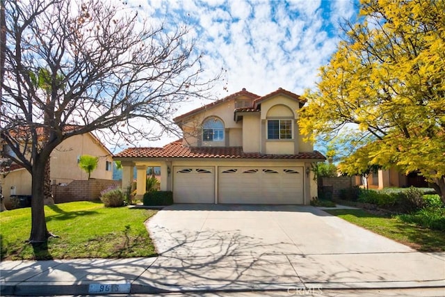mediterranean / spanish home with stucco siding, concrete driveway, a tile roof, and a front lawn