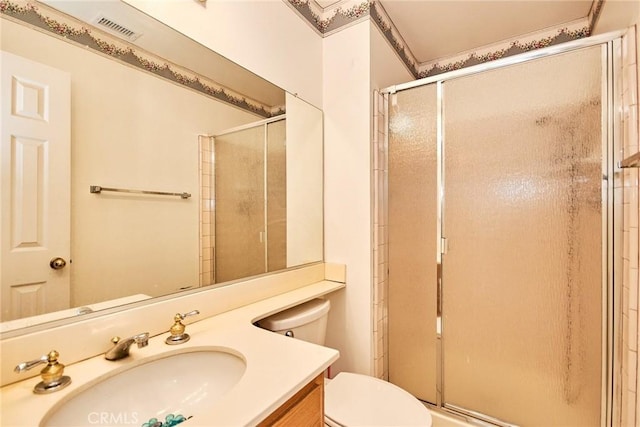 bathroom featuring visible vents, toilet, and a shower stall