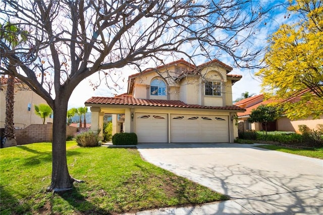 mediterranean / spanish-style house featuring stucco siding, a tiled roof, concrete driveway, and a front lawn