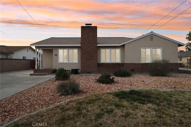 1202 W Lancaster Blvd, Lancaster, CA 93534 - single story home featuring a chimney, stucco siding, and brick siding
