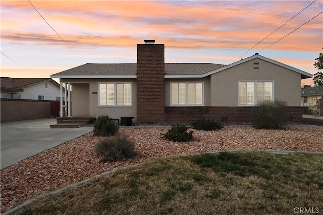 1202 W Lancaster Blvd, Lancaster, CA 93534 - single story home with a chimney, stucco siding, and brick siding