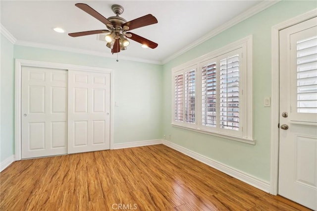 1202 W Lancaster Blvd, Lancaster, CA 93534 - unfurnished bedroom with wood finished floors, baseboards, a closet, ornamental molding, and ceiling fan