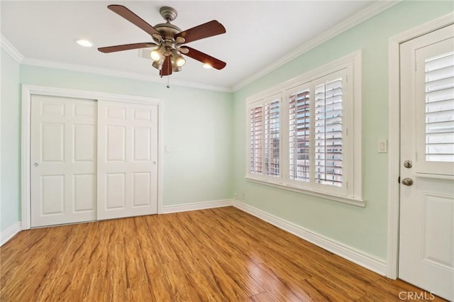 1202 W Lancaster Blvd, Lancaster, CA 93534 - unfurnished bedroom with wood finished floors, a closet, ornamental molding, and a ceiling fan