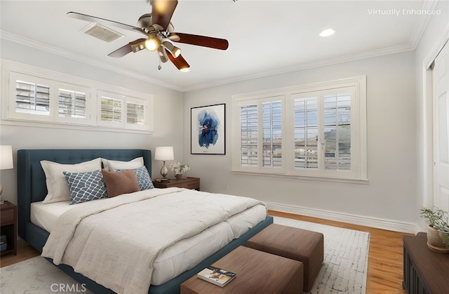 1202 W Lancaster Blvd, Lancaster, CA 93534 - bedroom featuring light wood-style floors, multiple windows, ornamental molding, baseboards, and ceiling fan