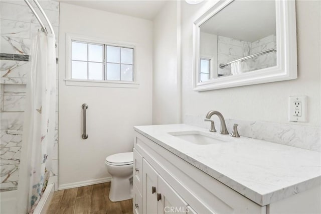 1202 W Lancaster Blvd, Lancaster, CA 93534 - bathroom with vanity, toilet, healthy amount of natural light, and wood finished floors