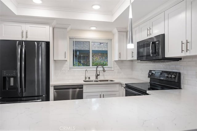 647 Avenida Sevilla Unit A, Laguna Woods, CA 92637 - kitchen featuring ornamental molding, white cabinets, black appliances, a tray ceiling, and a sink