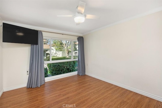647 Avenida Sevilla Unit A, Laguna Woods, CA 92637 - empty room featuring baseboards, a ceiling fan, crown molding, and wood finished floors
