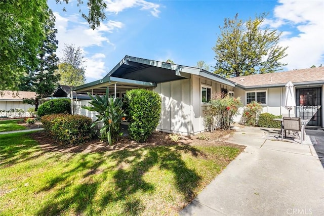 647 Avenida Sevilla Unit A, Laguna Woods, CA 92637 - view of front of home featuring a front lawn
