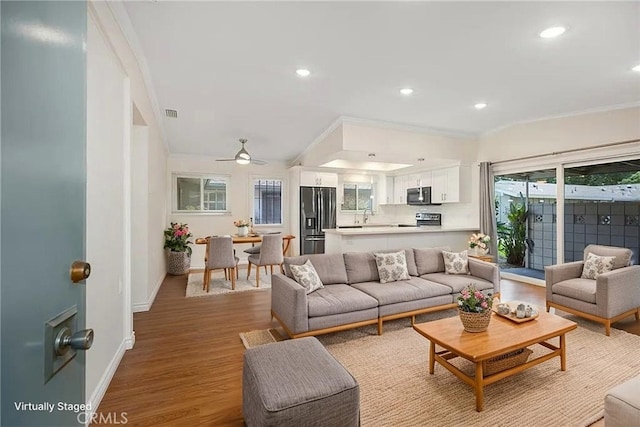 647 Avenida Sevilla Unit A, Laguna Woods, CA 92637 - living area with recessed lighting, baseboards, crown molding, and wood finished floors