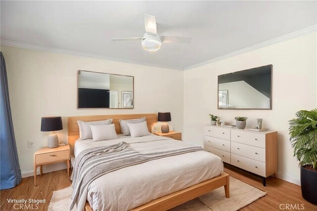 647 Avenida Sevilla Unit A, Laguna Woods, CA 92637 - bedroom featuring light wood-style flooring, baseboards, and ornamental molding