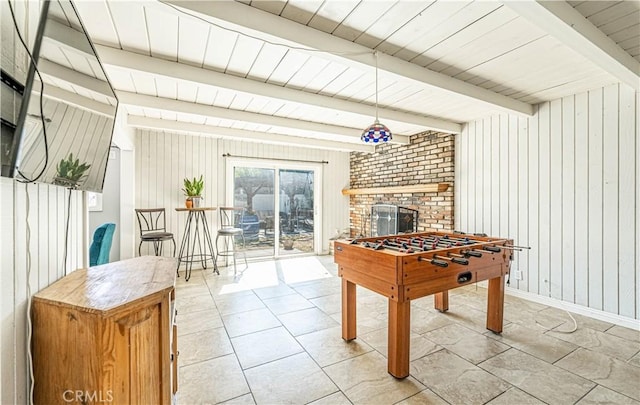 1307 N Allyn Ave, Ontario, CA 91764 - playroom featuring light tile patterned floors, wooden walls, a brick fireplace, and a wooden ceiling with exposed beams