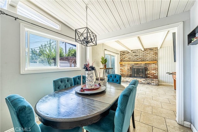 1307 N Allyn Ave, Ontario, CA 91764 - dining area featuring a chandelier, a fireplace, and light stone finish flooring
