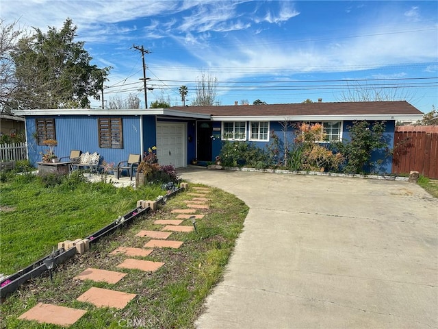 1307 N Allyn Ave, Ontario, CA 91764 - view of front facade with an attached garage and concrete driveway