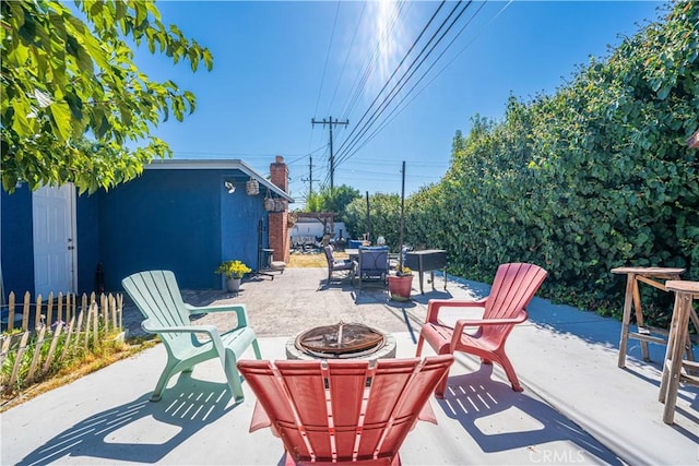 1307 N Allyn Ave, Ontario, CA 91764 - view of patio featuring an outdoor fire pit, outdoor dining space, and an outbuilding