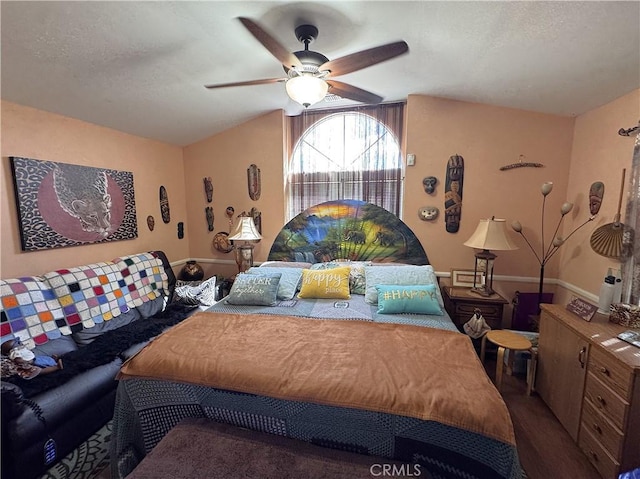 433 Oakmont Dr, Barstow, CA 92311 - bedroom with lofted ceiling, a ceiling fan, and a textured ceiling