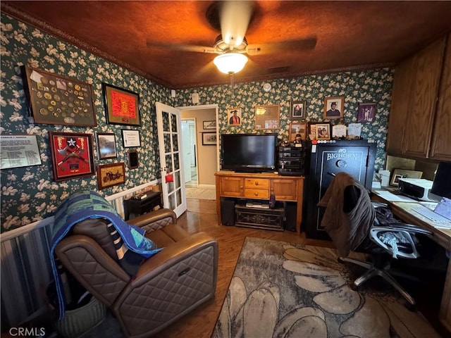 433 Oakmont Dr, Barstow, CA 92311 - living area with wood finished floors, ceiling fan, and wallpapered walls