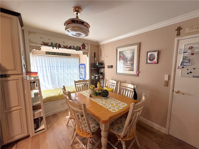 433 Oakmont Dr, Barstow, CA 92311 - dining area featuring baseboards, ornamental molding, and light wood finished floors