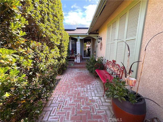 433 Oakmont Dr, Barstow, CA 92311 - entrance to property with roof mounted solar panels and stucco siding