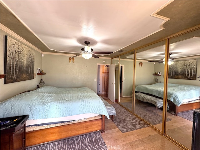 433 Oakmont Dr, Barstow, CA 92311 - bedroom with ceiling fan, light wood-style floors, and ornamental molding