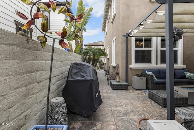 view of patio featuring an outdoor living space, a pergola, and grilling area