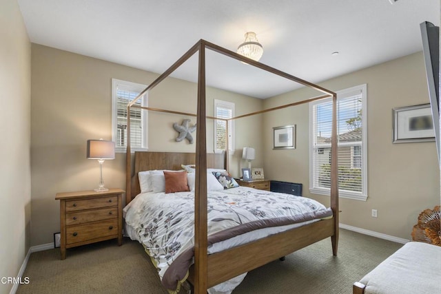 bedroom with baseboards and carpet floors