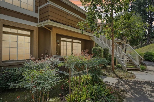 doorway to property with stucco siding
