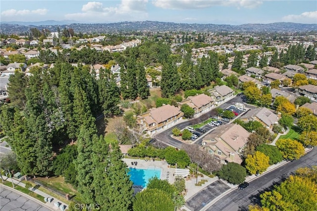 birds eye view of property with a mountain view and a residential view