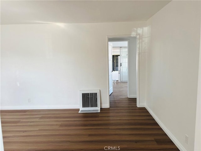 155 E Century Blvd, Los Angeles, CA 90003 - empty room featuring baseboards and dark wood-type flooring