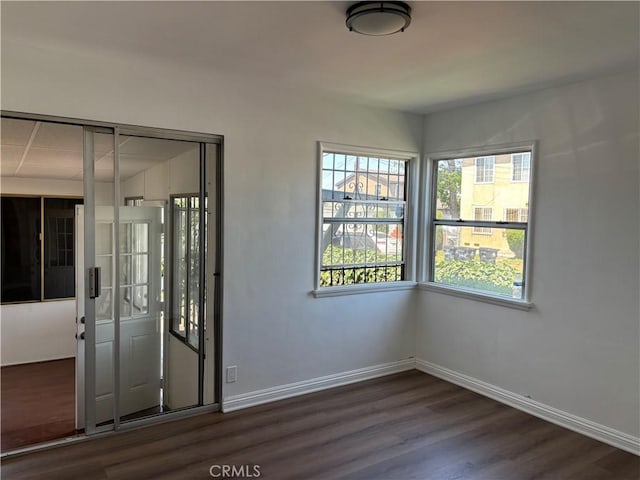 155 E Century Blvd, Los Angeles, CA 90003 - empty room featuring dark wood finished floors and baseboards