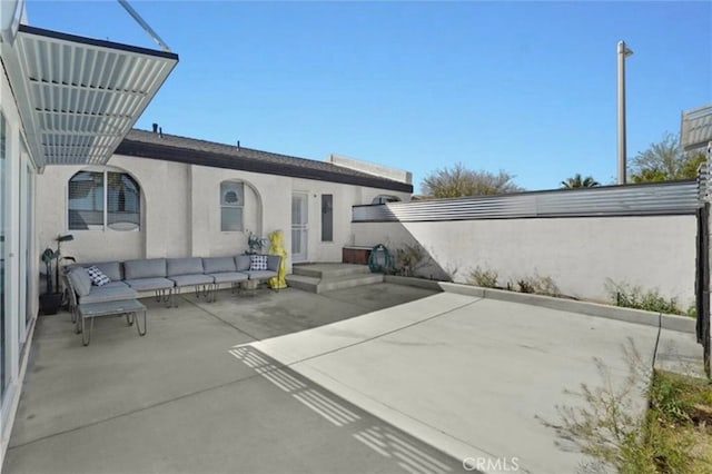3291 N Sandspring Dr, Palm Springs, CA 92262 - back of house with stucco siding, an outdoor hangout area, and a patio area