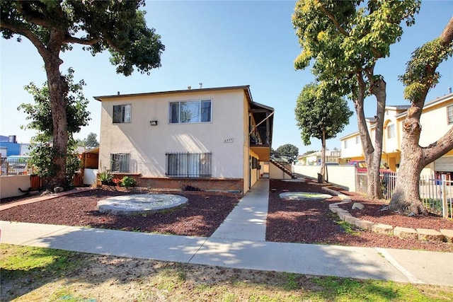 6335 Loma Vista Ave, Bell, CA 90201 - view of front facade with stucco siding and stairway