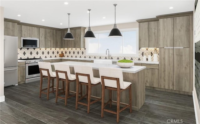 kitchen with modern cabinets, dark wood-type flooring, a breakfast bar, a center island, and stainless steel appliances
