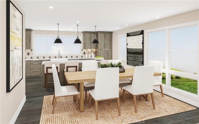 dining room with dark wood-style flooring, baseboards, and recessed lighting
