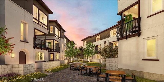 view of property at dusk