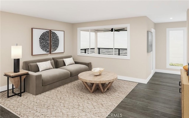 living area with recessed lighting, dark wood-type flooring, and baseboards