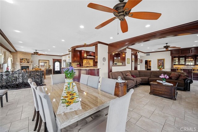 dining area with ornamental molding, recessed lighting, and a ceiling fan