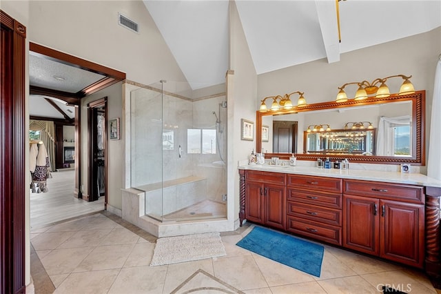 full bathroom with lofted ceiling, a shower stall, and tile patterned flooring