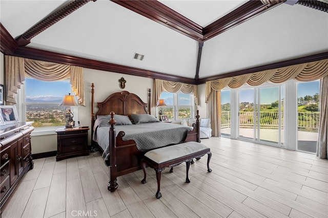 bedroom featuring access to exterior, visible vents, light wood-style flooring, and multiple windows