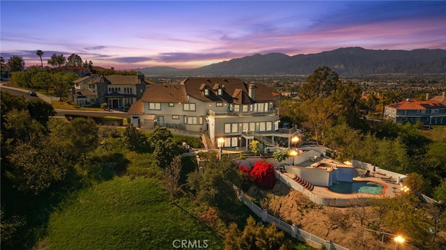 aerial view at dusk with a mountain view