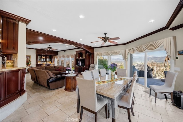dining area featuring stone tile floors, a ceiling fan, crown molding, and recessed lighting