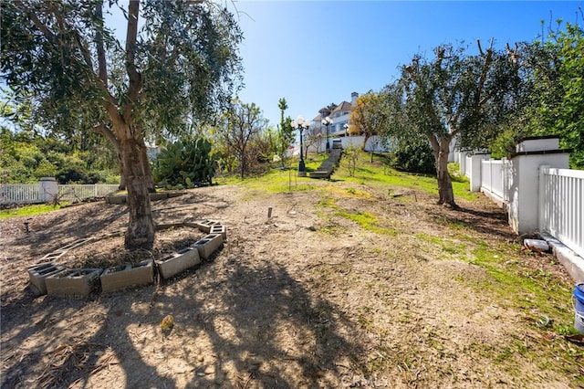view of yard featuring fence