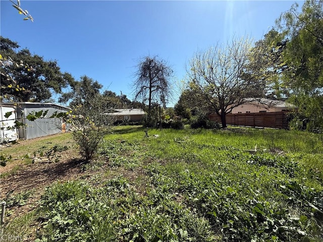 view of yard featuring fence