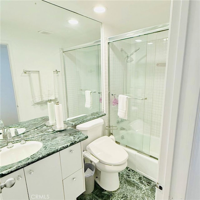 bathroom with vanity, toilet, recessed lighting, and bath / shower combo with glass door