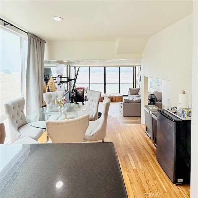 dining space featuring light wood-style flooring