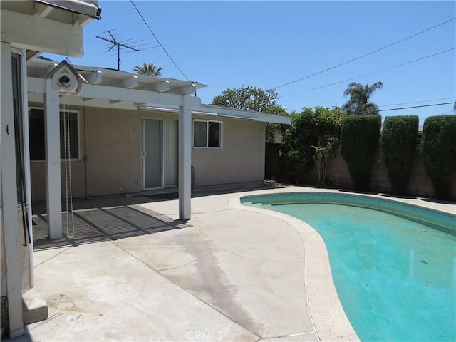 view of pool with a patio area, a fenced backyard, and a fenced in pool
