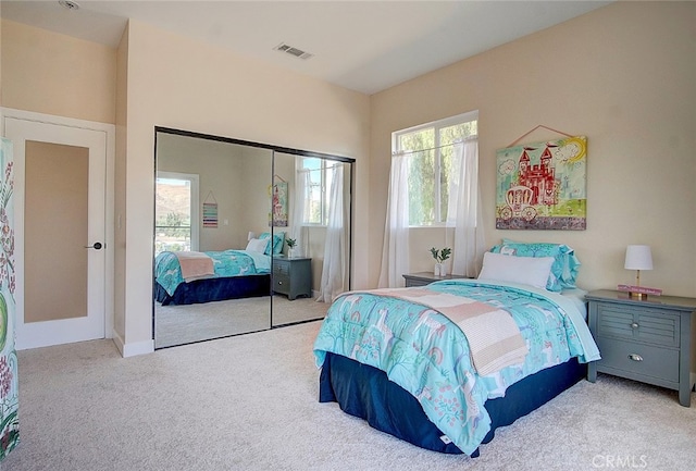 21655 Temescal Canyon Rd, Corona, CA 92883 - carpeted bedroom with a closet, visible vents, and multiple windows