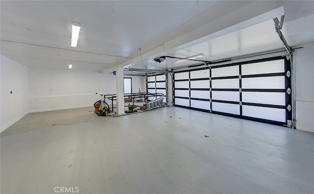 21655 Temescal Canyon Rd, Corona, CA 92883 - garage with a garage door opener and baseboards
