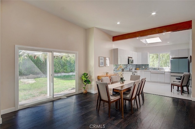21655 Temescal Canyon Rd, Corona, CA 92883 - dining area featuring baseboards, dark wood finished floors, beamed ceiling, recessed lighting, and a skylight