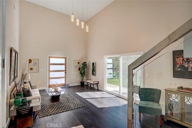 21655 Temescal Canyon Rd, Corona, CA 92883 - foyer entrance with dark wood-style floors, high vaulted ceiling, and baseboards