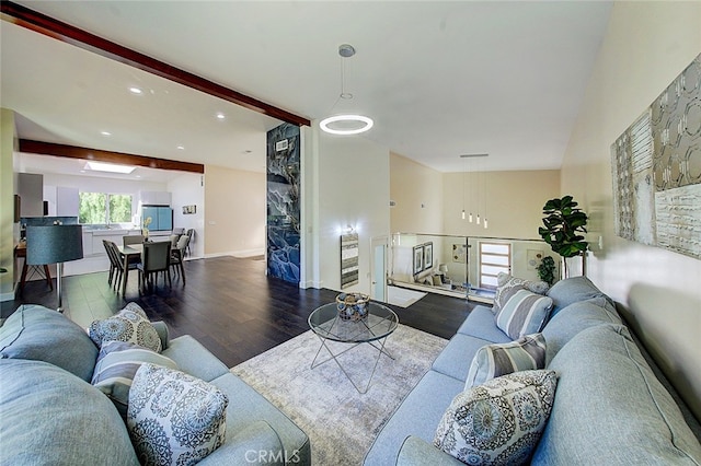 21655 Temescal Canyon Rd, Corona, CA 92883 - living room featuring beamed ceiling, baseboards, and wood finished floors